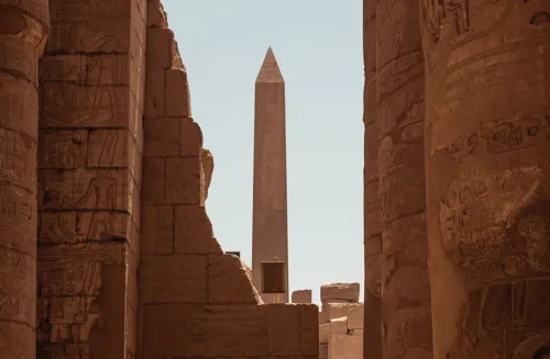 A tall pointed monument built in sandstone, part of a museum in Cairo, Egypt.