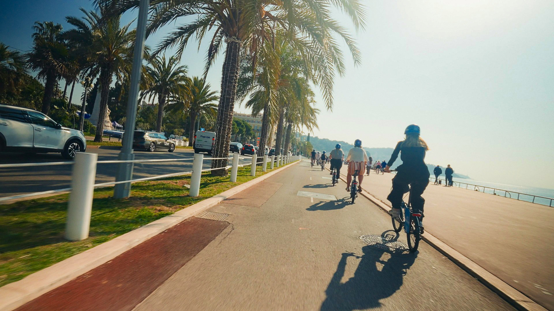 Traveller enjoying a bicycle ride experience in Nice, France