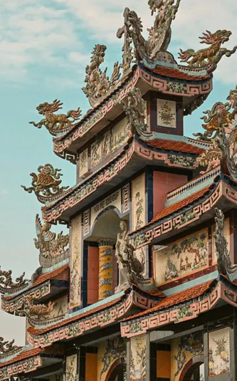 Ornate pagoda at Minh Cung Temple in Vietnam, showcasing traditional architecture - Contiki HCMC, Hoi An & Hanoi Tour