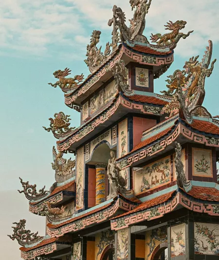 Ornate pagoda at Minh Cung Temple in Vietnam, showcasing traditional architecture - Contiki HCMC, Hoi An & Hanoi Tour