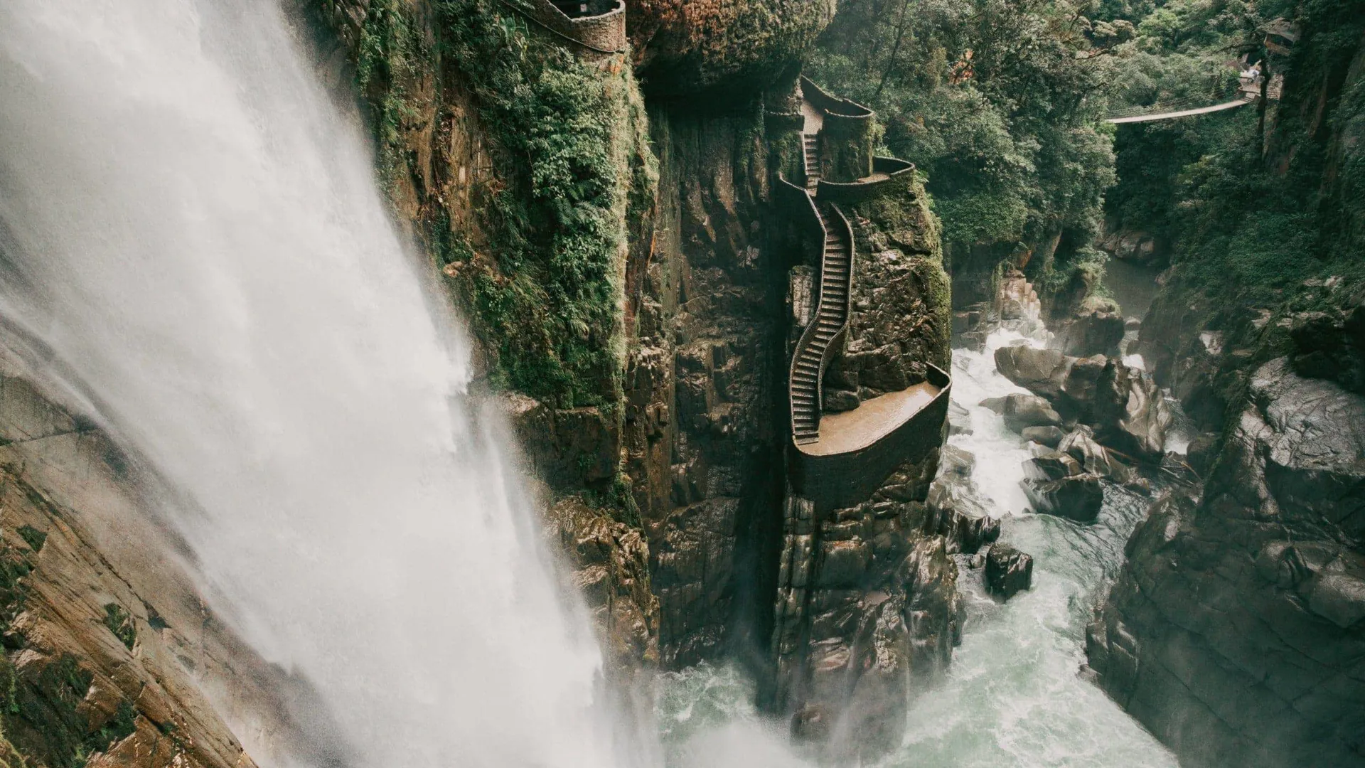 The cascading Pailón del Diablo waterfall flows through a lush canyon on the Contiki Best of Ecuador & Galapagos Islands Tour