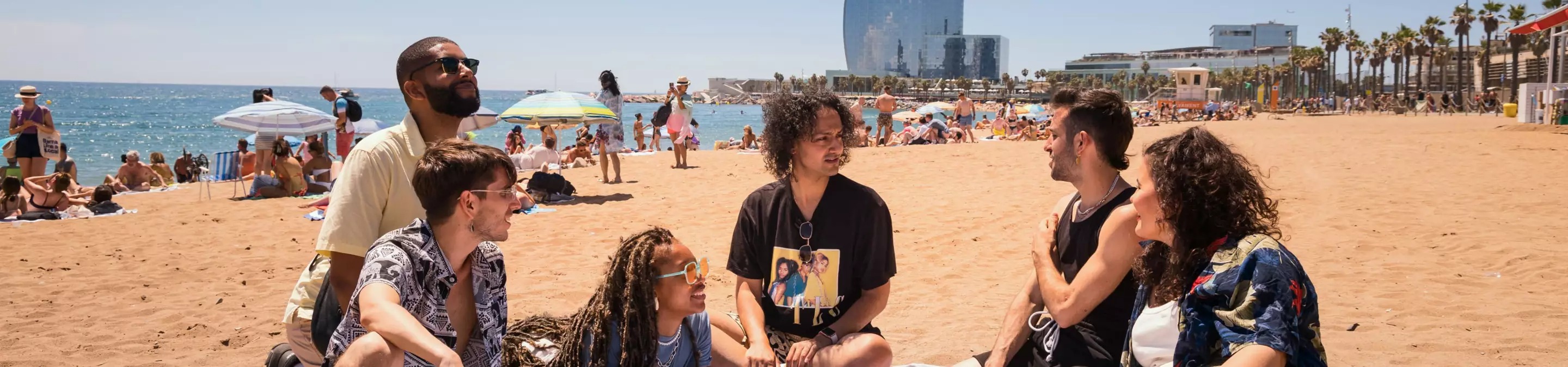 Travellers enjoying the sun in Barcelona, Spain