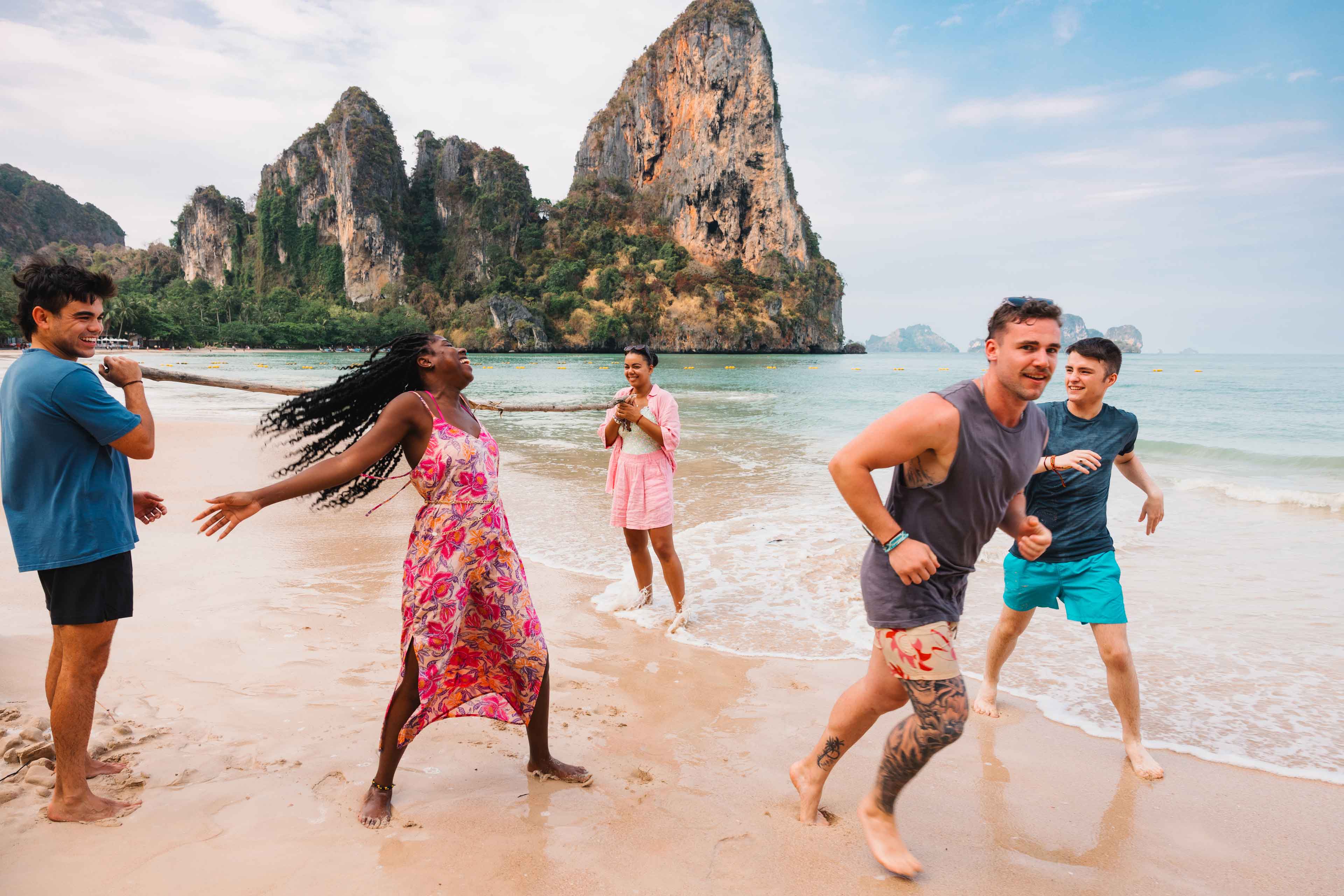 Group Of Young Travelers Having Fun Beach Thailand