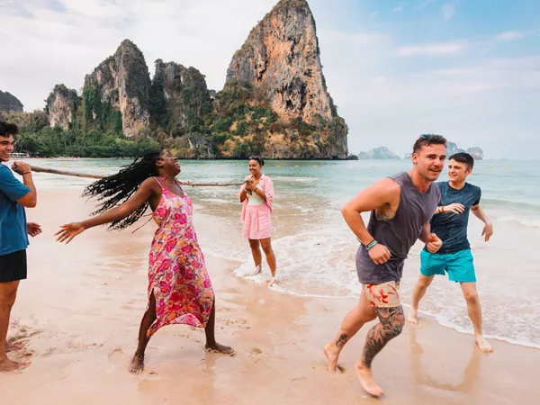 Group Of Young Travelers Having Fun Beach Thailand