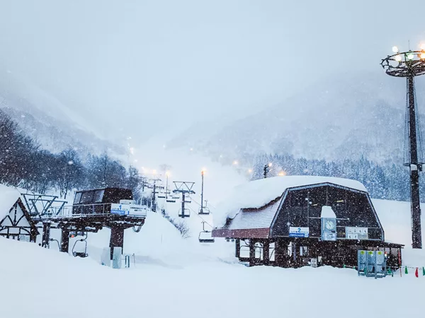 Landscape Of Mountains With Ski Lift Snowing