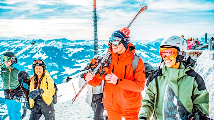 Travellers and instructor during a guided ski tour of the mountain in Hopfgarten, Austria.