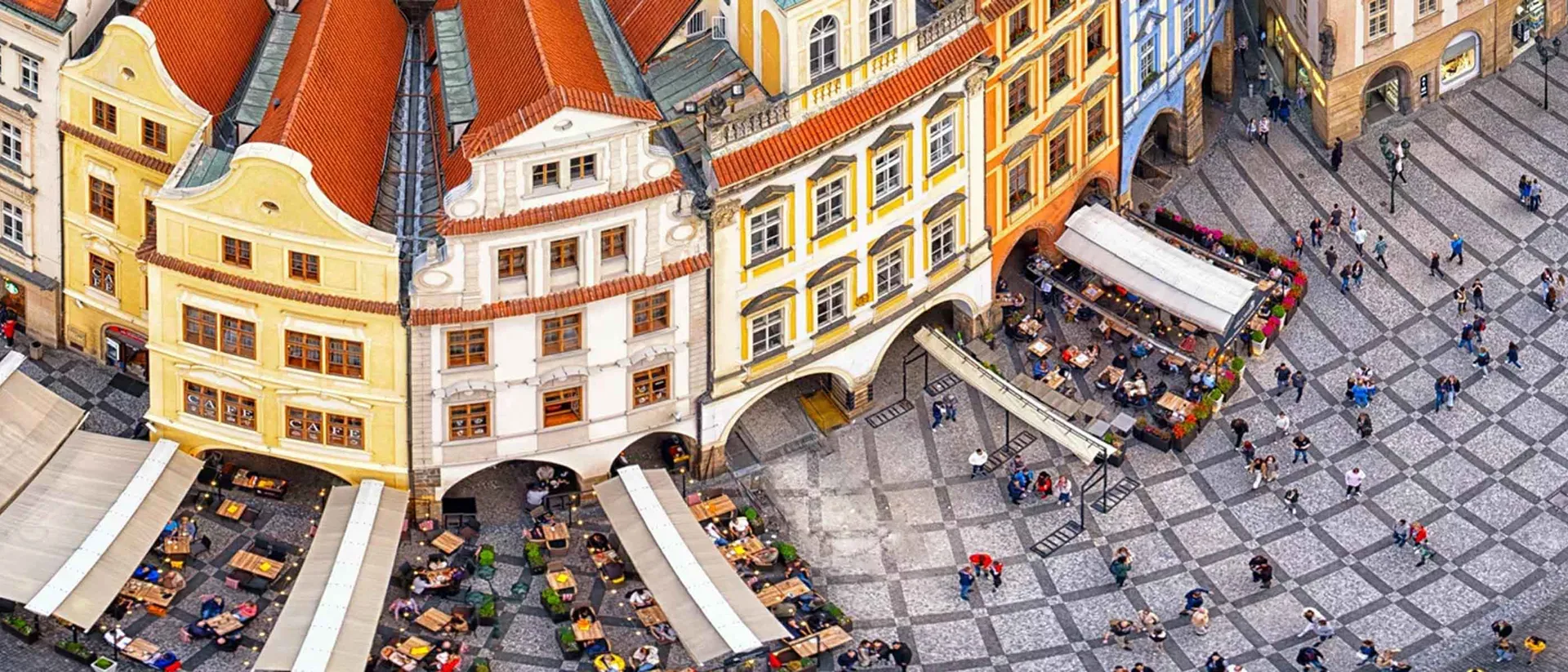 Block Of Colourful Houses Road With People Walking Around