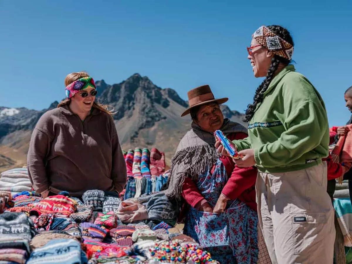 Travelers In Peru With Local