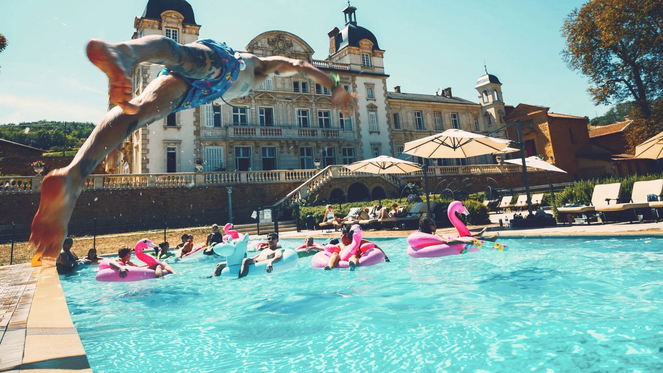 Travellers enjoying a pool party at Contiki's French château - Contiki European Adventurer Tour