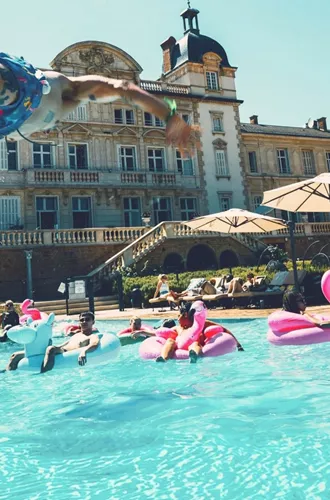 Travellers enjoying a pool party at Contiki's French château - Contiki European Adventurer Tour