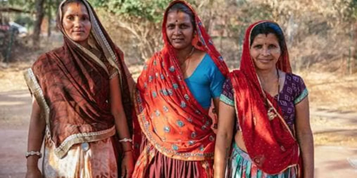 Three Indian women posing for a photo