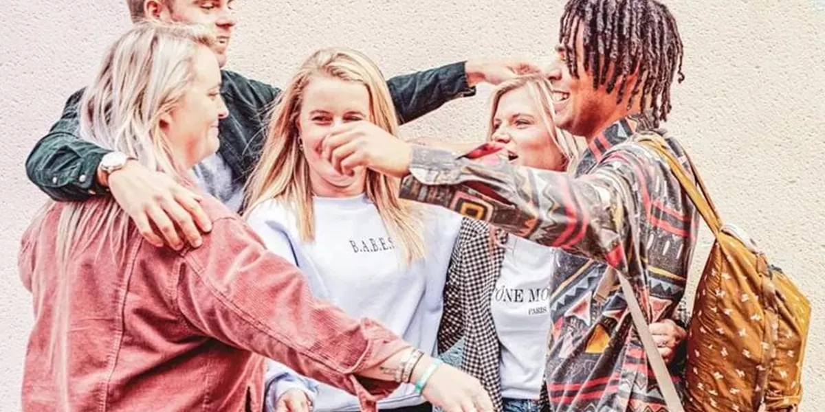A Group of Young People Hugging Each Other