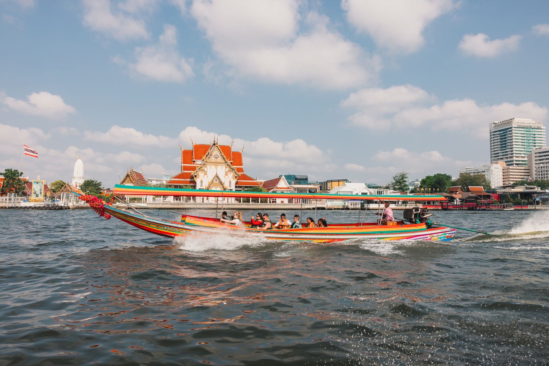 People Riding A Large Boat Sunny Day