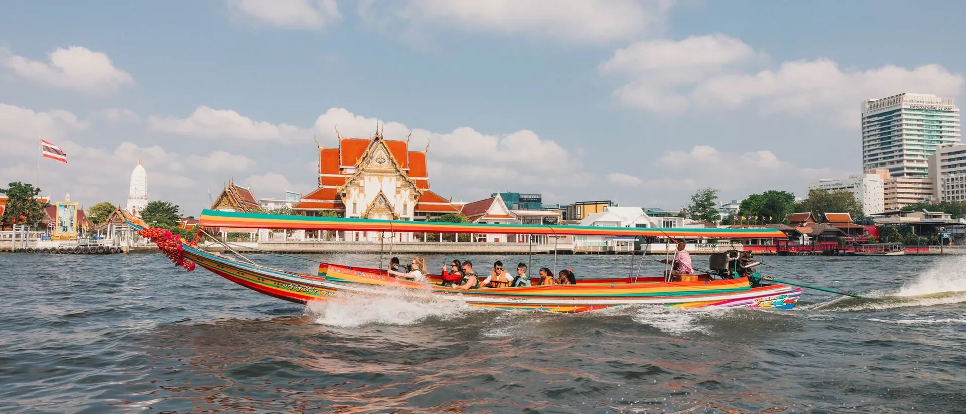 People Riding A Large Boat Sunny Day