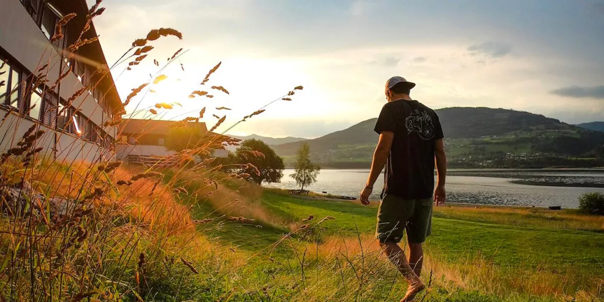 Man Walking Through Scandinavian Fields