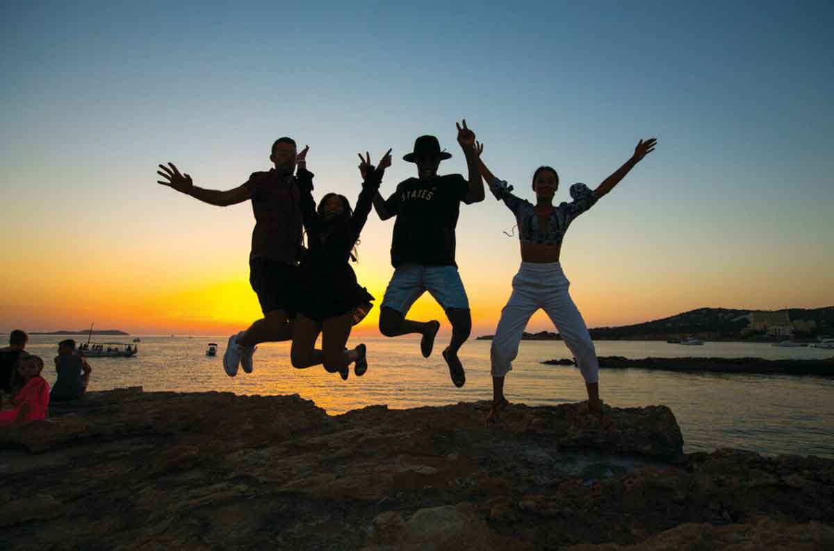 Group Jumping Sunset Ocean