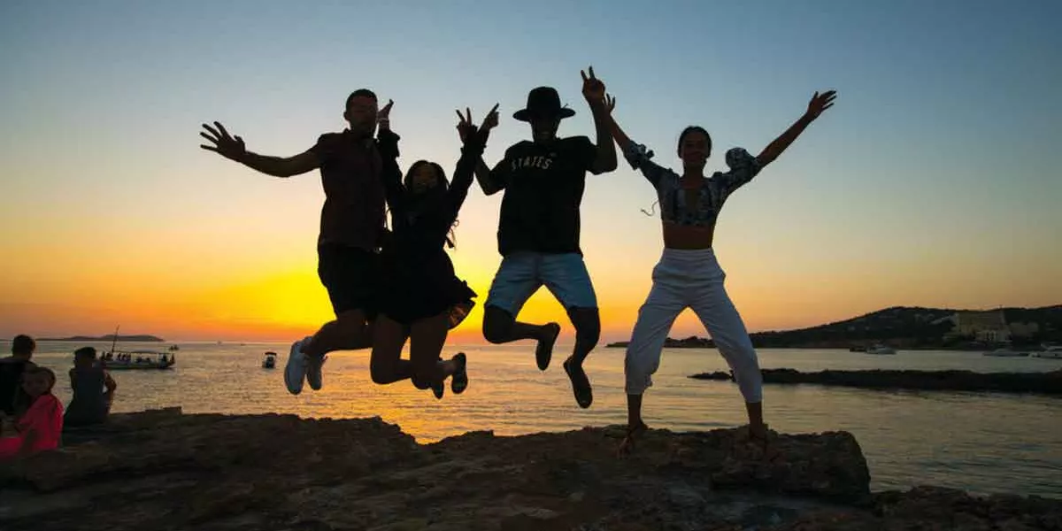 Group Jumping Sunset Ocean