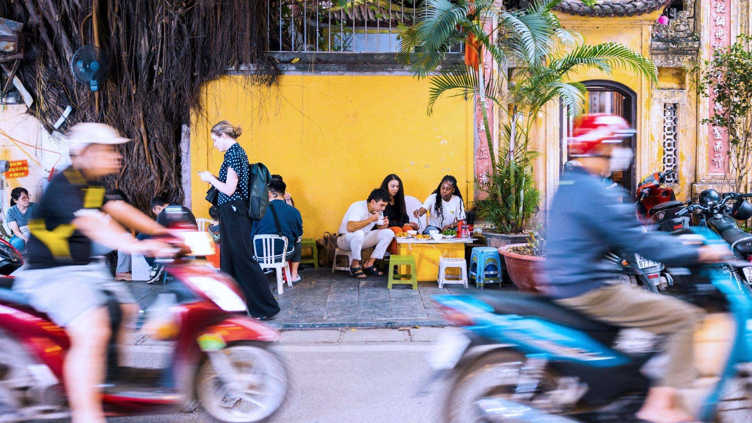 Contiki travellers sampling Vietnamese street food in Hoi An - Contiki Hanoi to Siem Reap Tour