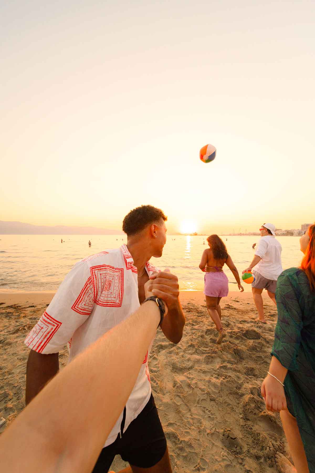 Friends on a beach in Albania at sunset