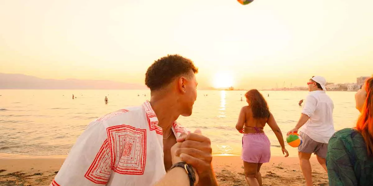 Friends on a beach in Albania at sunset