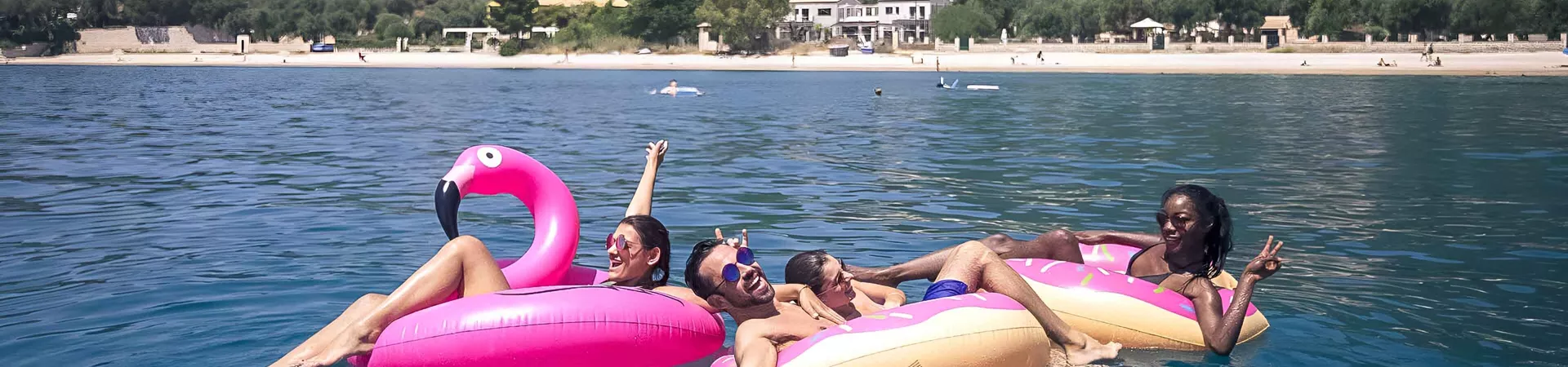 Young Group Of Friends In The Sea