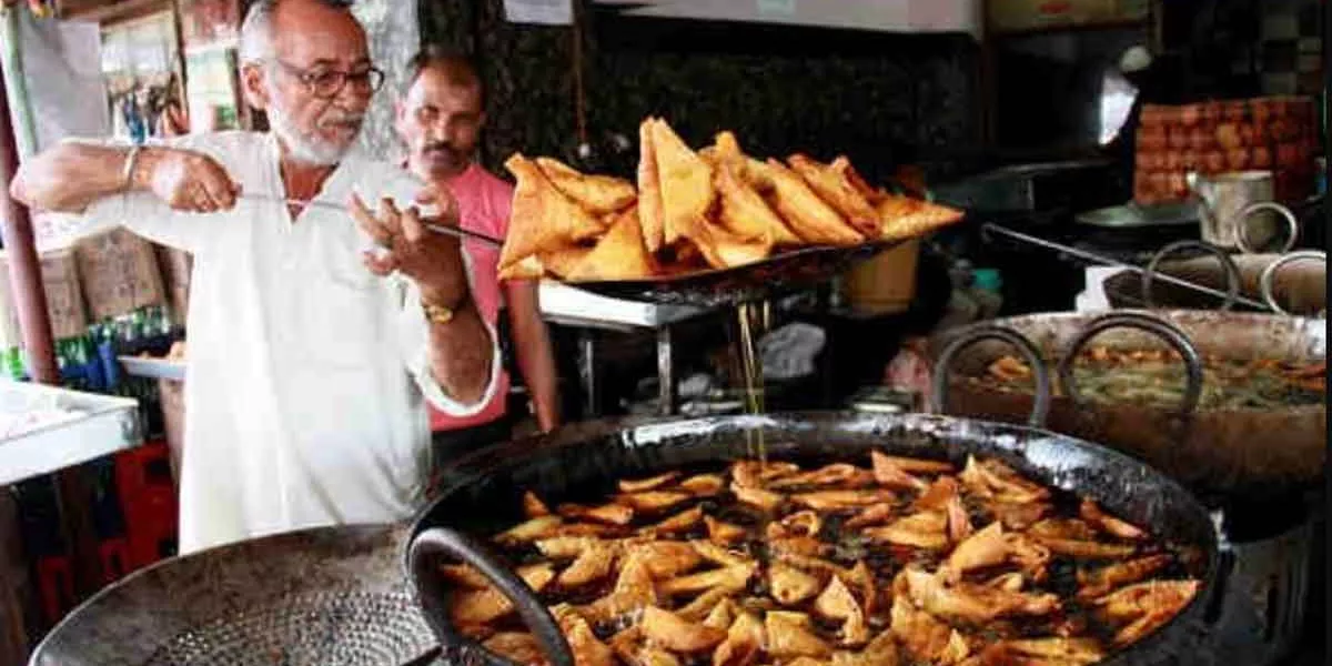 Man Cooking Samosas