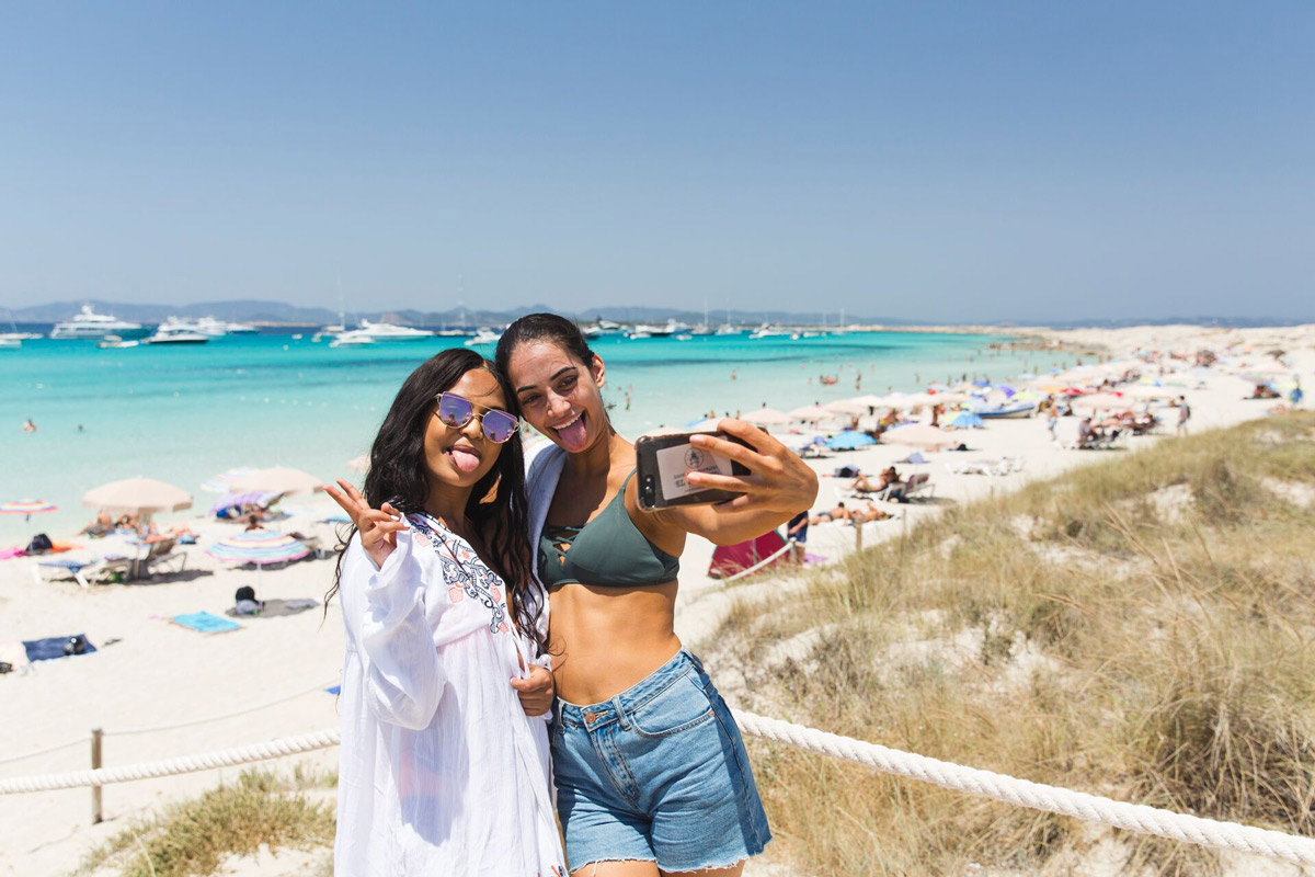 Two Friends Taking A Selfie While Enjoying A Beach Day 1