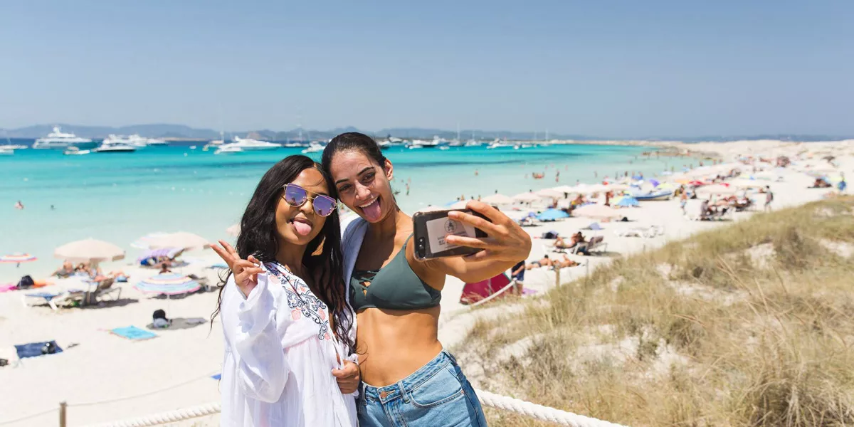 Two Friends Taking A Selfie While Enjoying A Beach Day 1