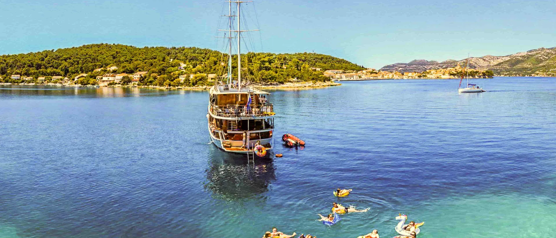 Boat with Contiki travellers on a island hopping in Croatia