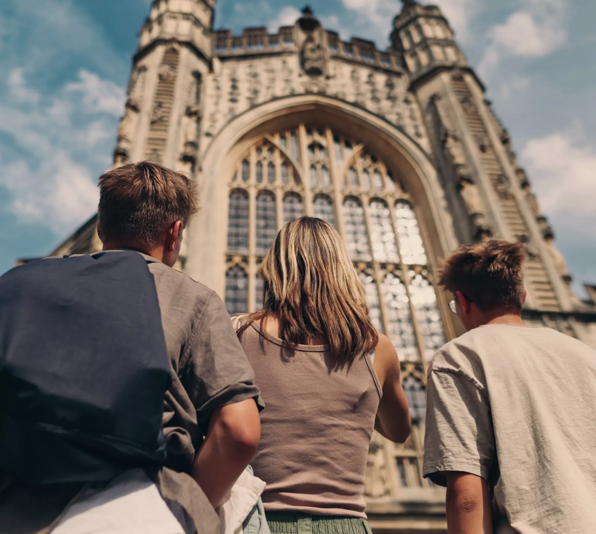 Travellers admire the historic Bath Abbey in Bath, England, during the Contiki England in a Week Tour