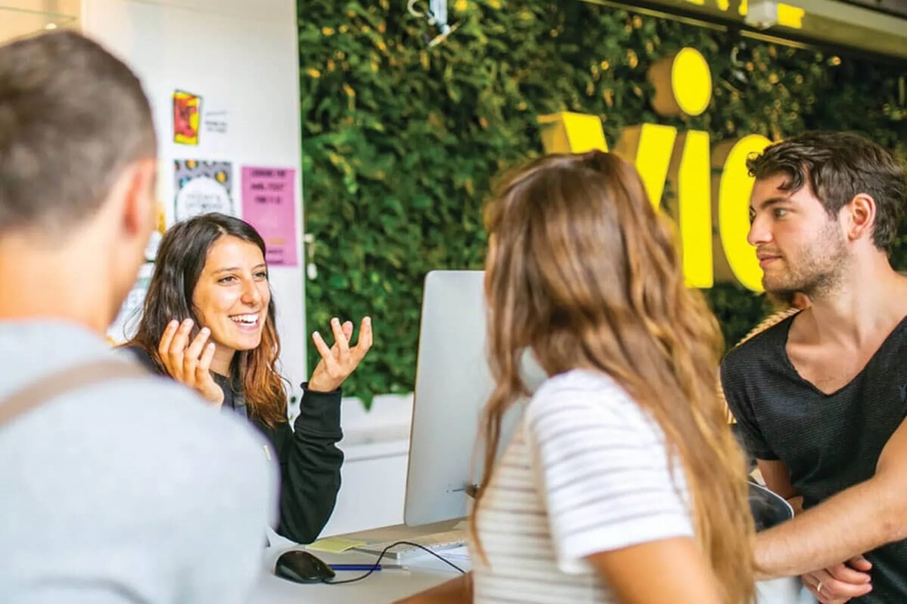 People talking with woman in reception