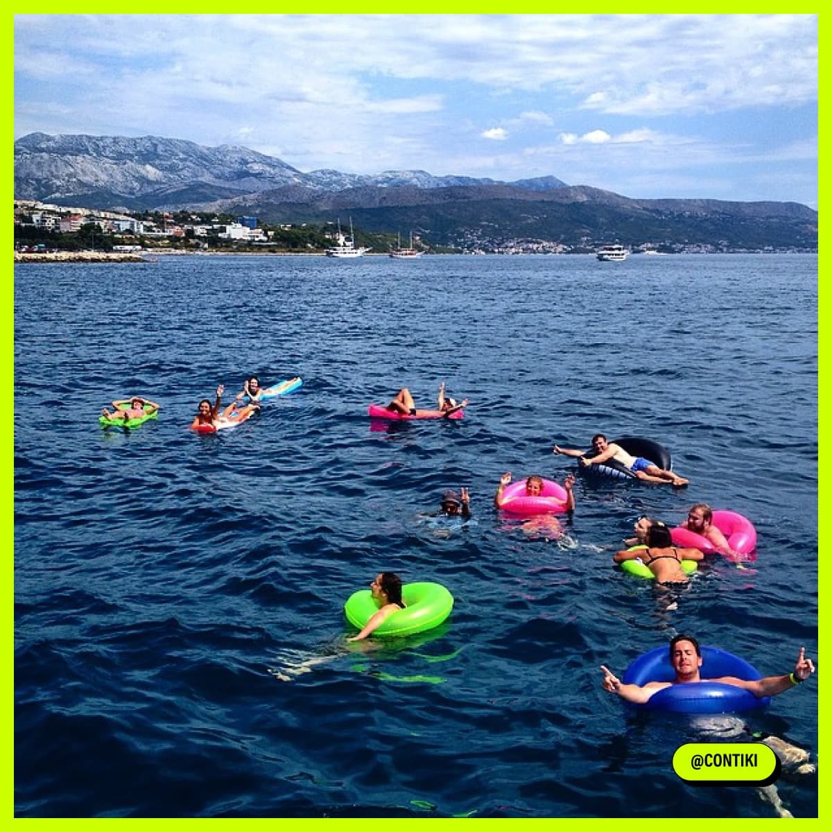 Travellers swimming on inflatables