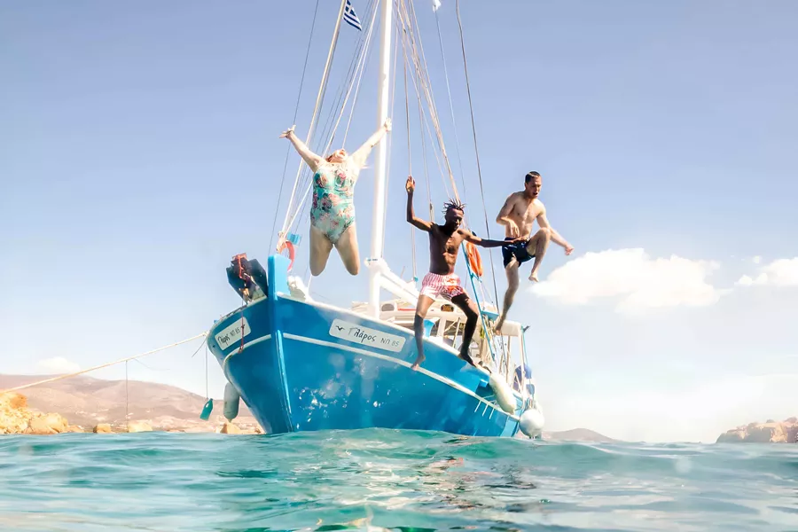 Group Jumping Into Sea From Boat In Greece 3197EURS2022