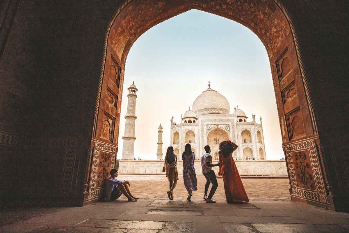 Groups Of People Looking At Taj Mahal