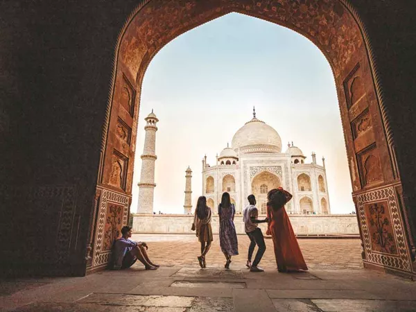 Groups Of People Looking At Taj Mahal