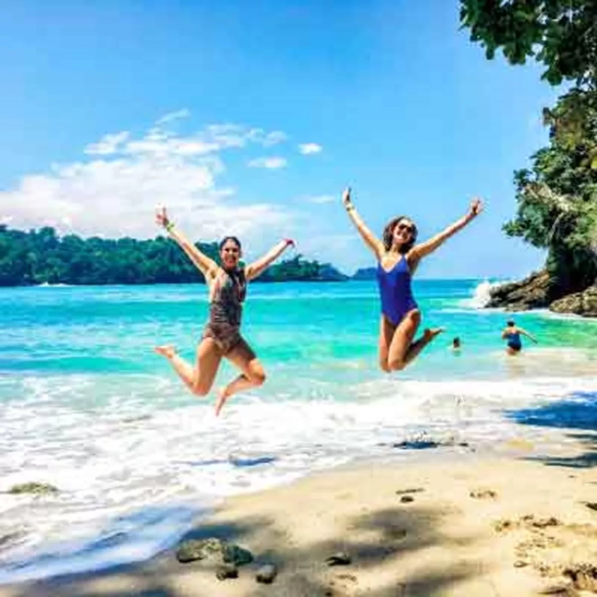 Two Travelers Jumping On Beach In Costa Rica