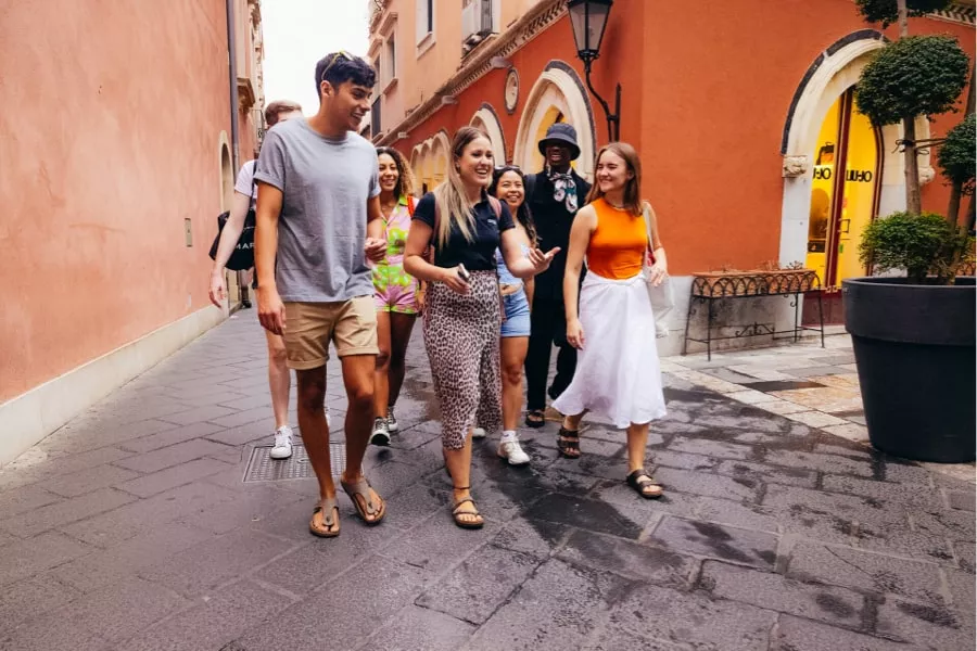 Group of contiki travellers in Italy guided by trip manager