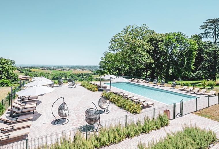 A view of a swimming pool in a French Chateau Tour