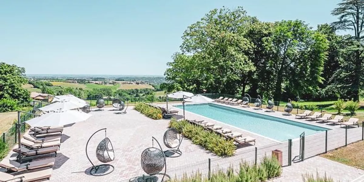 A view of a swimming pool in a French Chateau Tour
