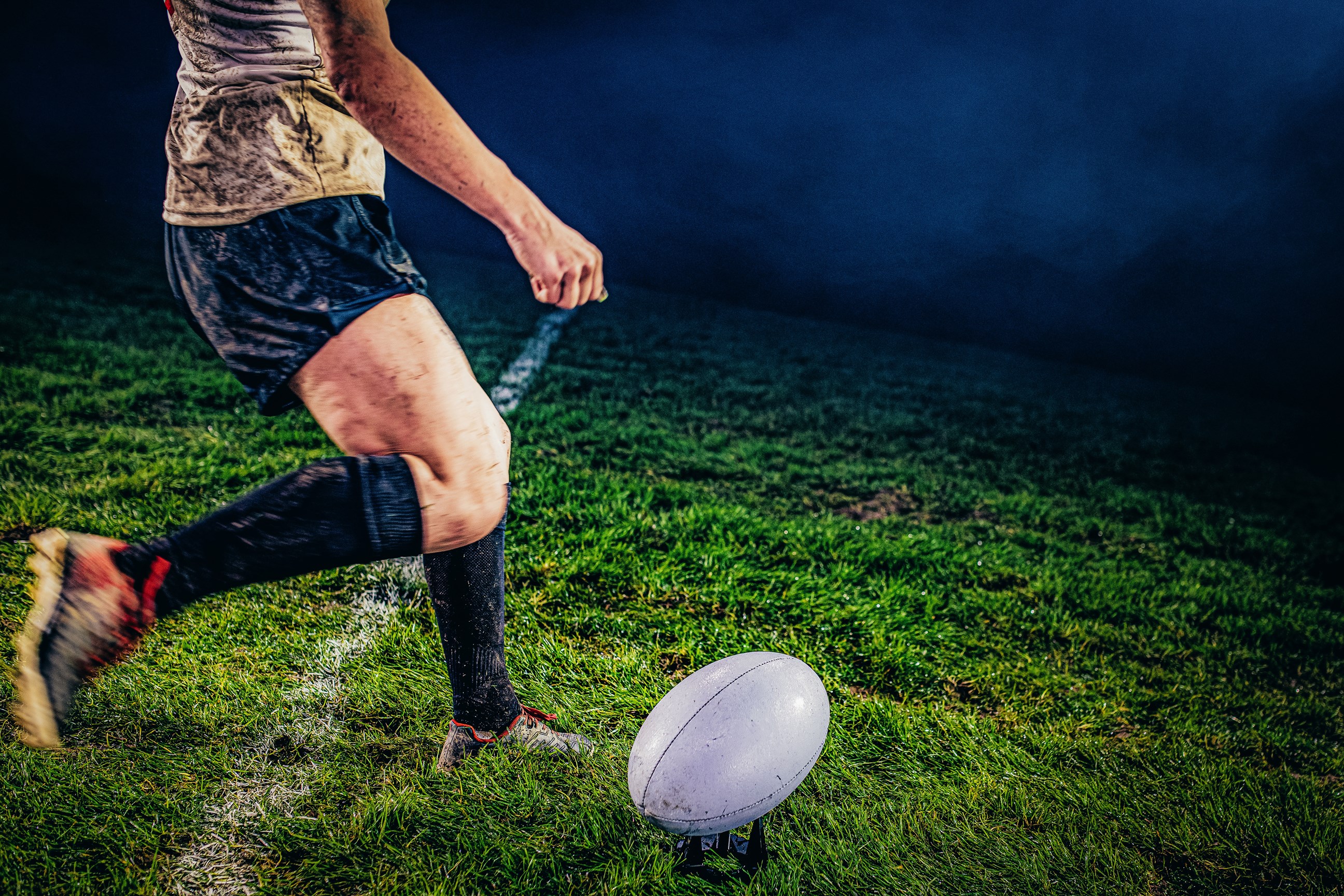 Rugby Player About to Kick Rugby Ball on Field, Auckland, New Zealand