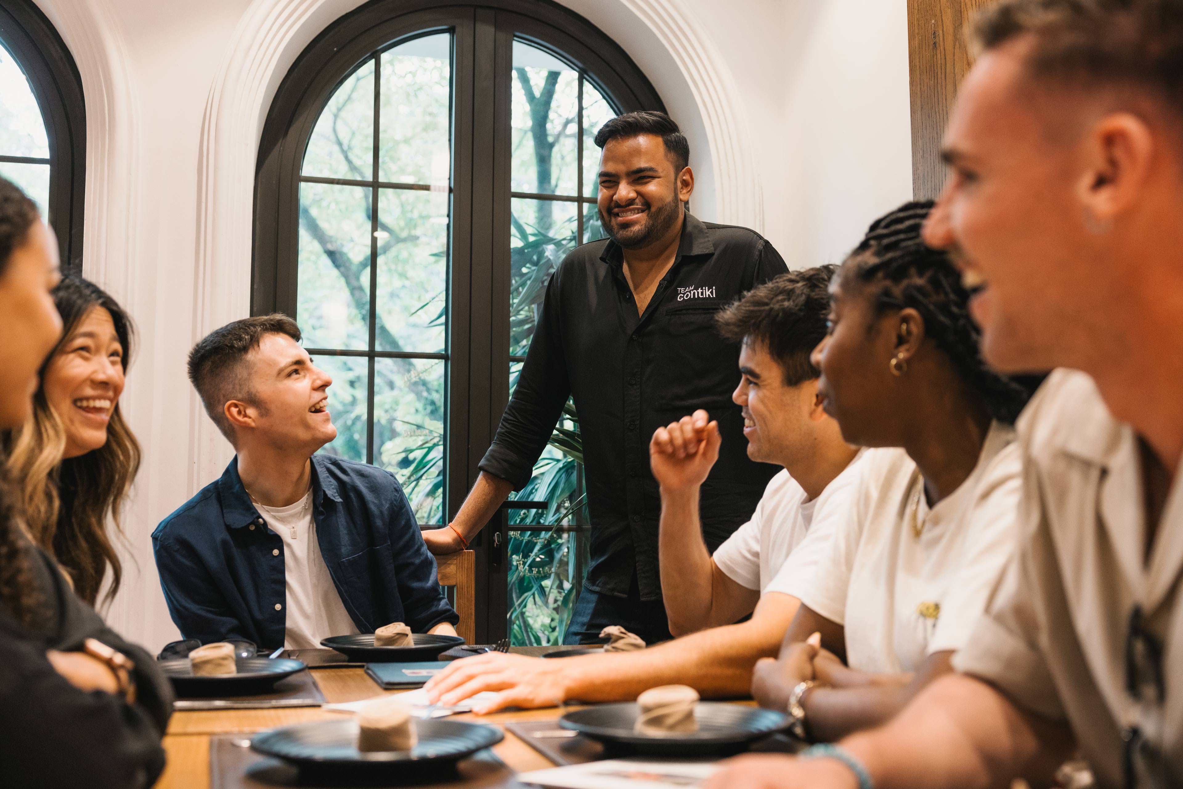 Group Laughing With Tour Manager