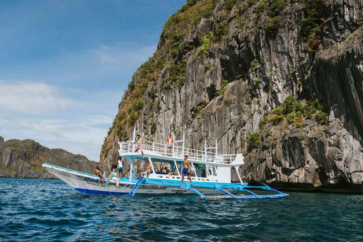 people-having-fun-in-a-boat-blue-sea.jpg