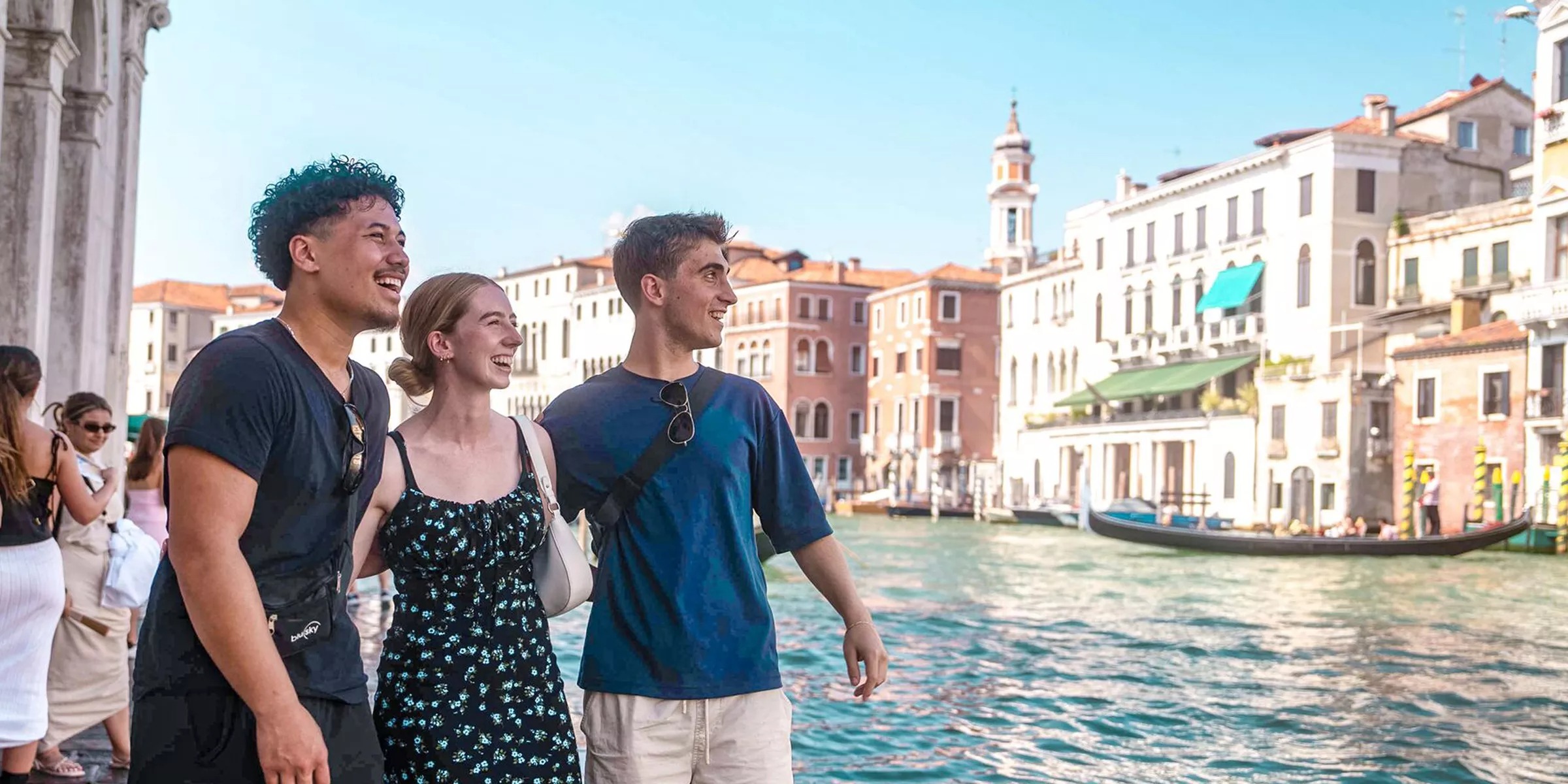 People Walking In Venice Close To Canal