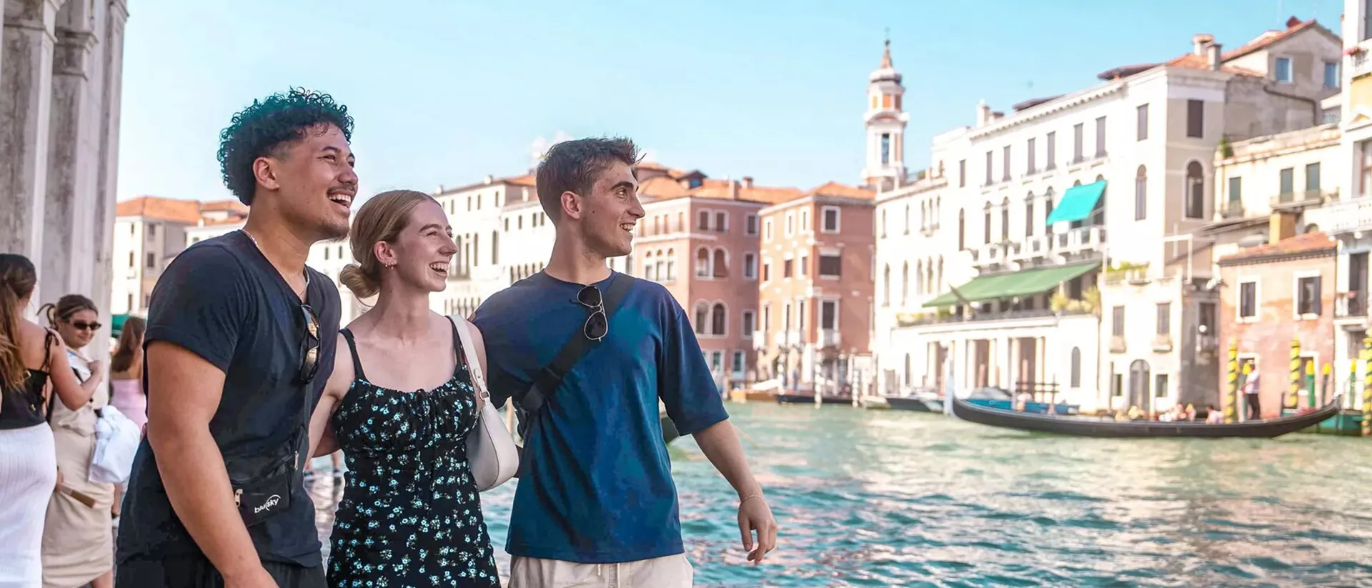 People Walking In Venice Close To Canal