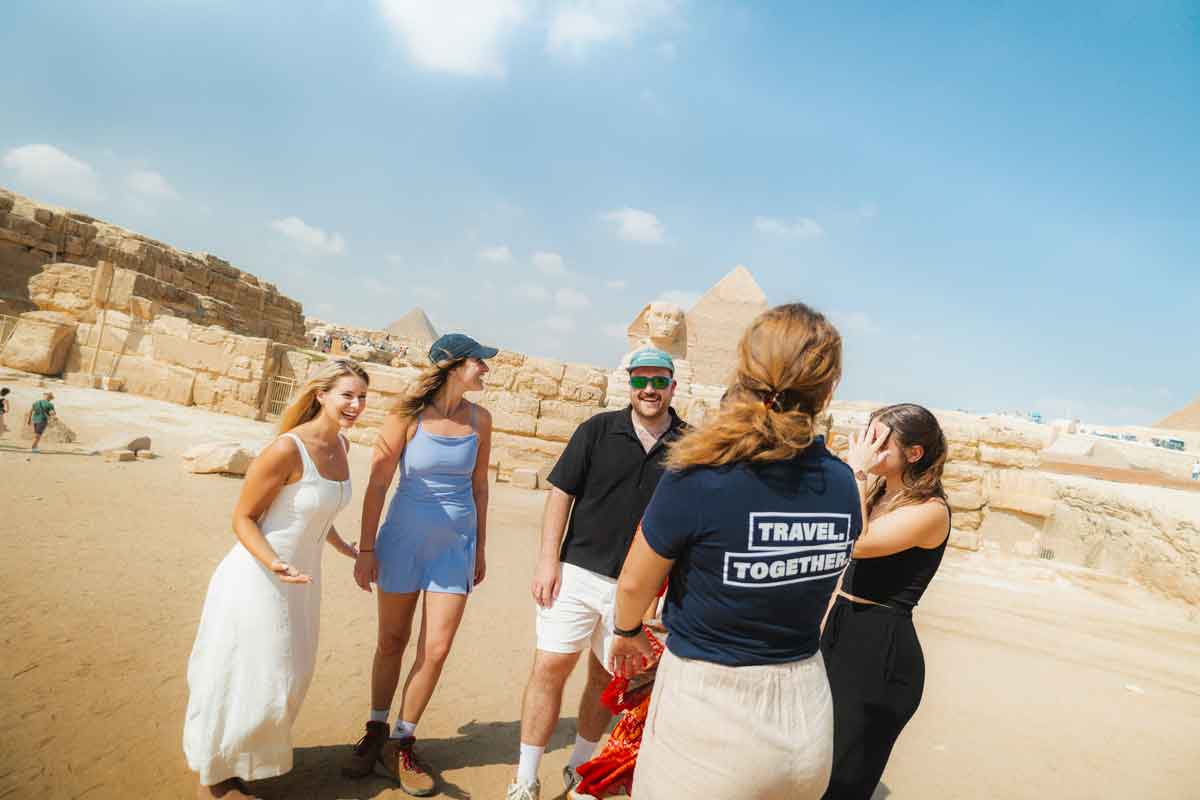 Travellers In Front Of The Pyraminds In Egypt