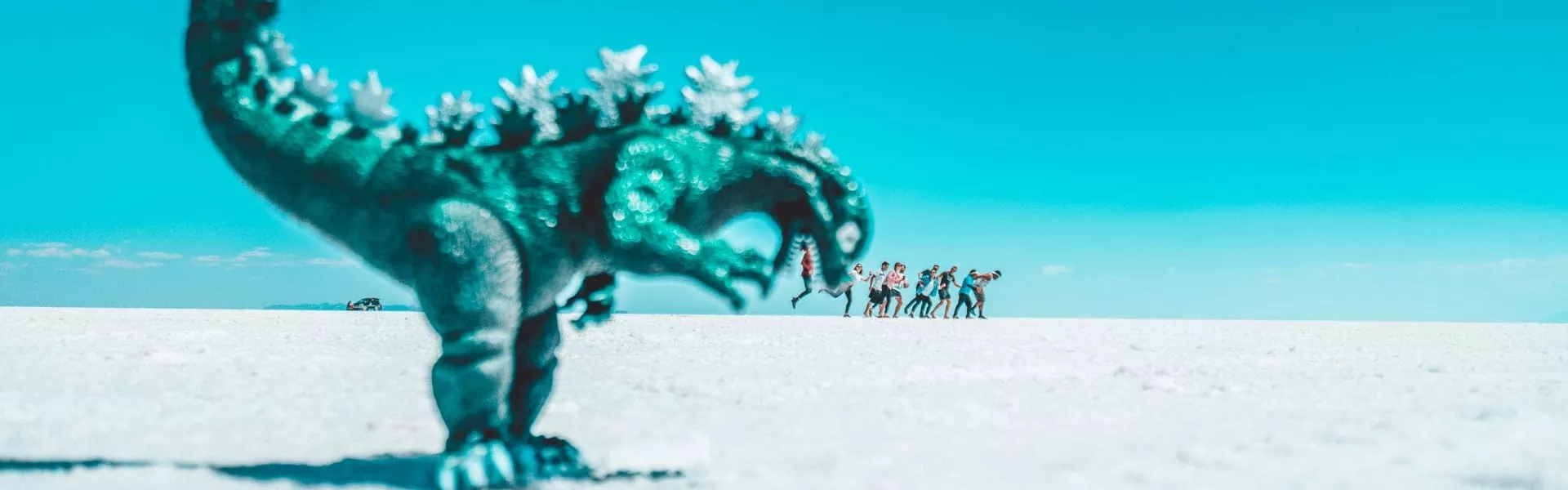 A group of people pretending to escape from a dinosaur