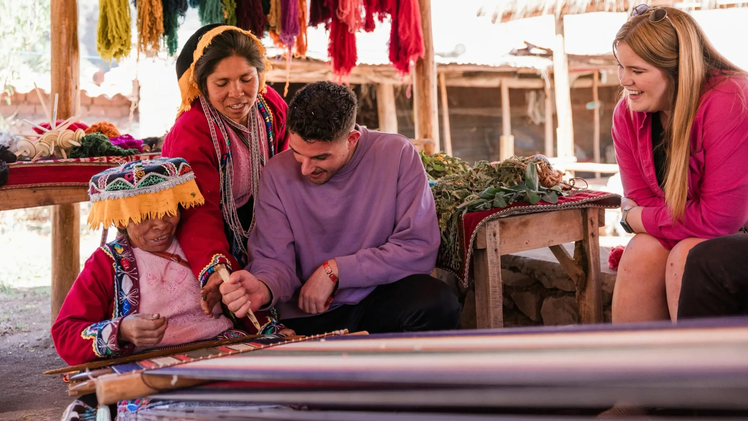 Local artisans demonstrating traditional Andean weaving - Contiki South American Explorer Tour