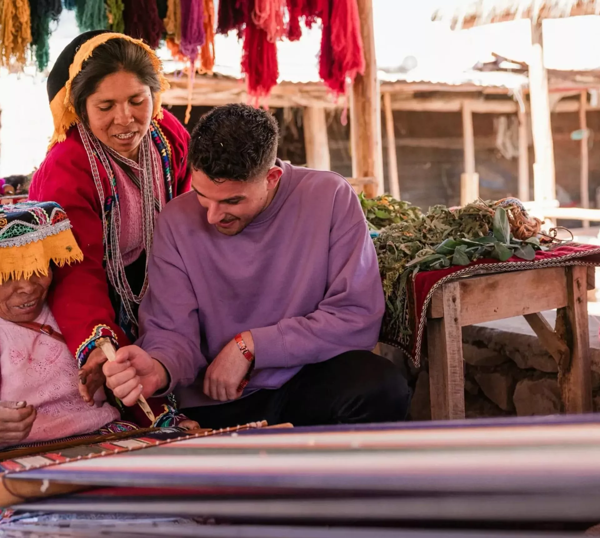 Local artisans demonstrating traditional Andean weaving - Contiki South American Explorer Tour