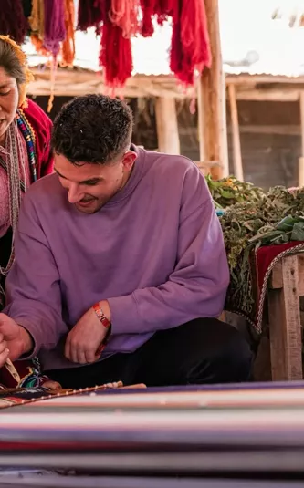 Local artisans demonstrating traditional Andean weaving - Contiki South American Explorer Tour