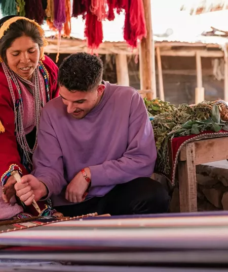 Local artisans demonstrating traditional Andean weaving - Contiki South American Explorer Tour